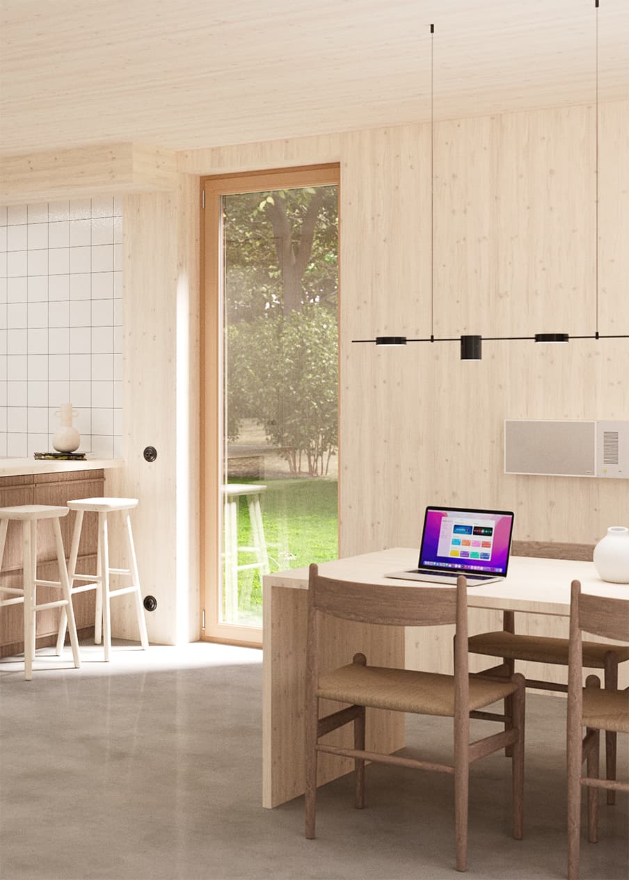 Dining space with framed artworks and integrated kitchen wall in birch plywood
